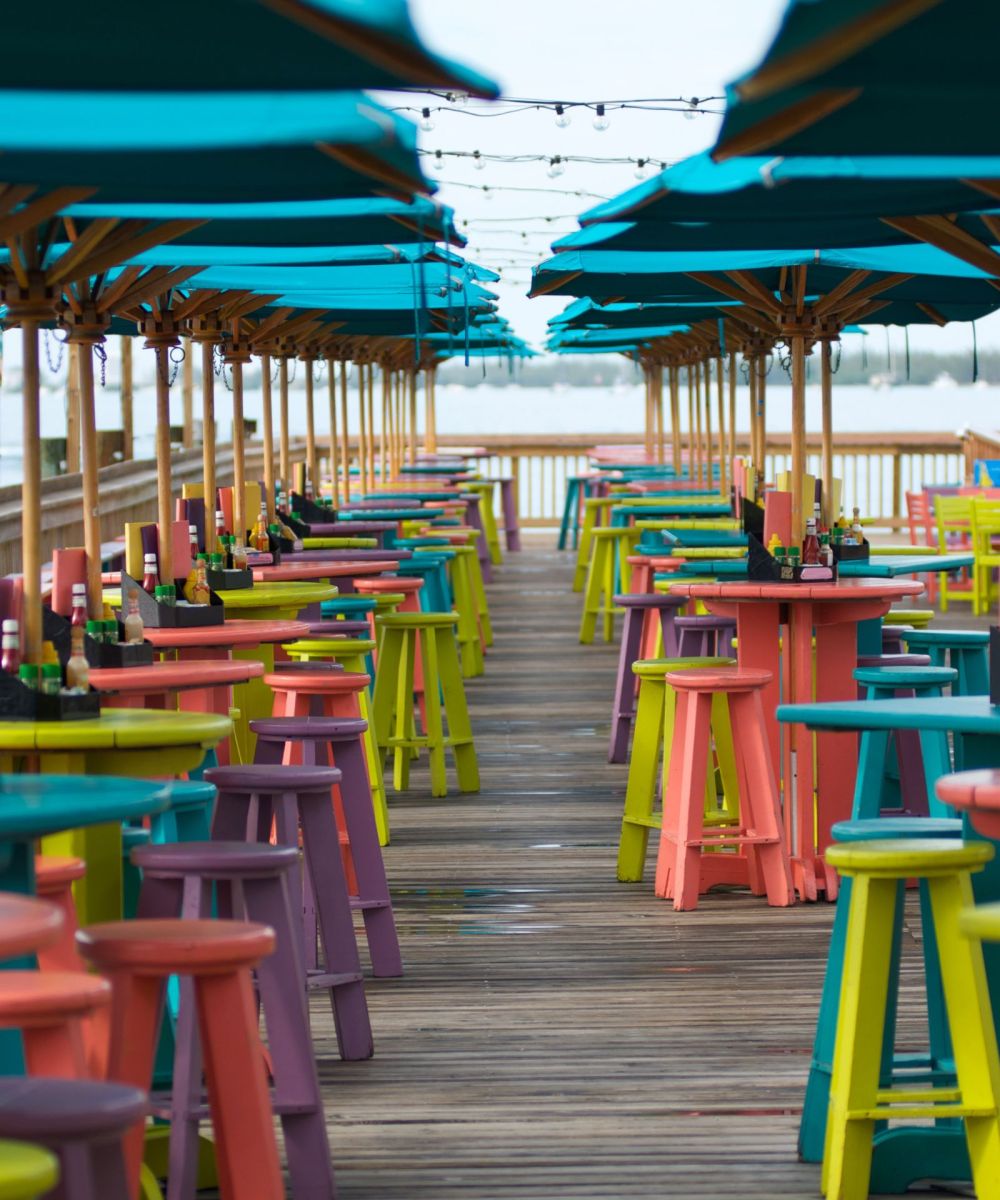 colorful chairs and tables at key west pier